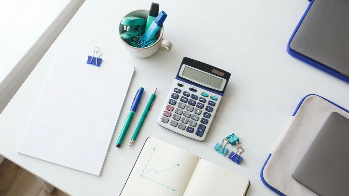Business desk prepared for weighing outsourcing costs and possible gains