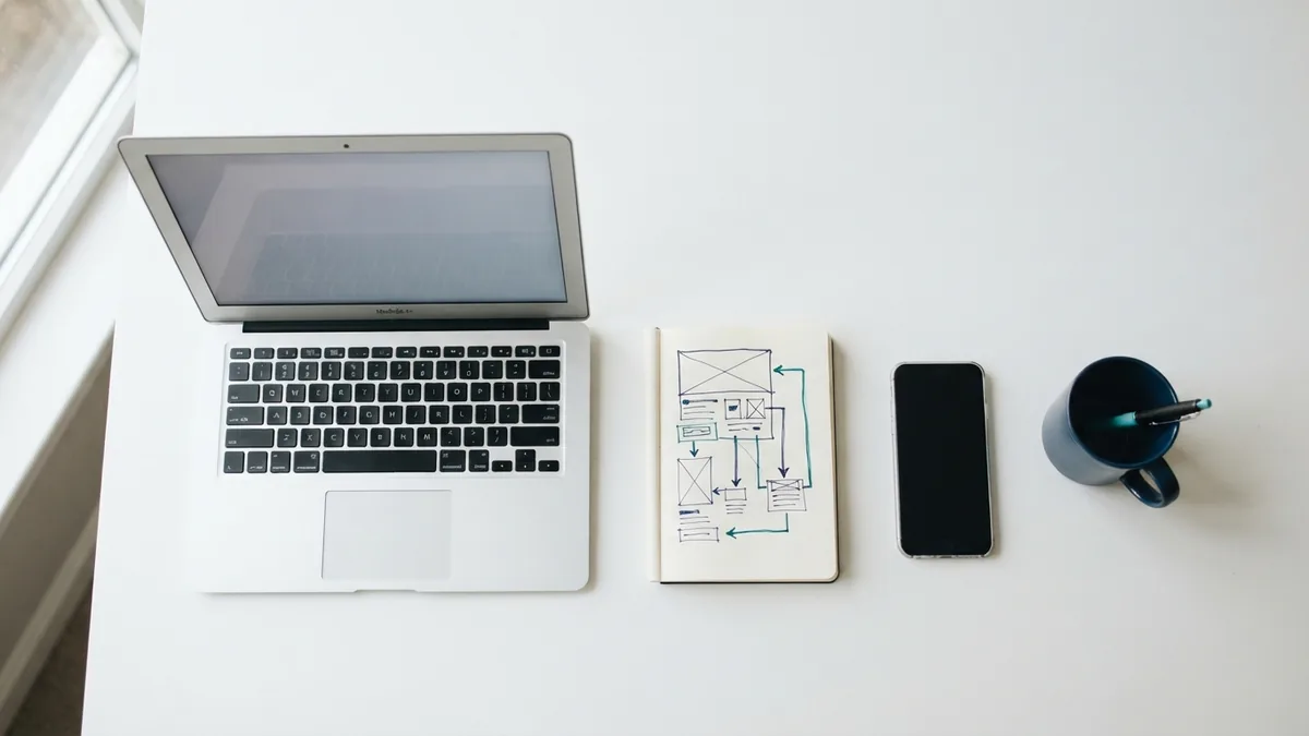 Checking a site's technical health Laptop, phone, and site map notes used to review technical website health